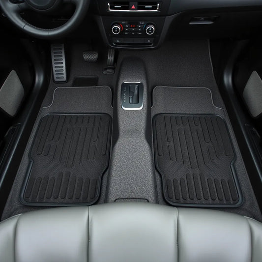 Car interior showing driver and passenger floor mats with clean, visible fit and textures