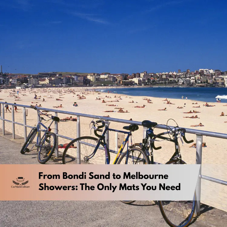 Bicycles parked along the railing at Bondi Beach with people relaxing on the sand under a clear blue sky