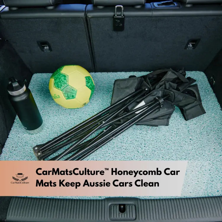 Car boot with soccer ball, water bottle, and folded chairs on Honeycomb car mat