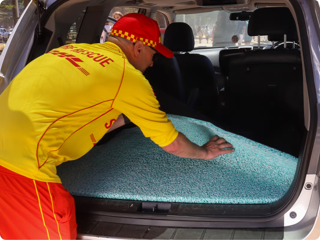Dog beside CMC honeycomb car mats