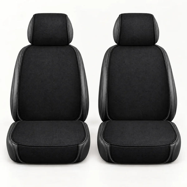 Pair of plain black front seat cushions with matching headrest covers on a light studio background