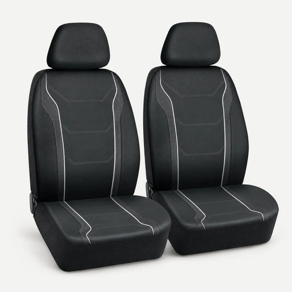 Pair of black front seat covers on a clean studio background