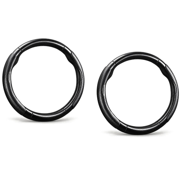 Two identical black segmented steering wheel covers on a clean white studio background
