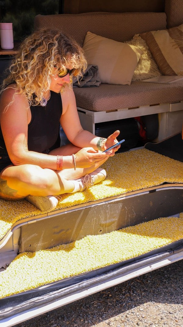 A CarMatsCulture customer lifting Honeycomb Mats from a real vehicle