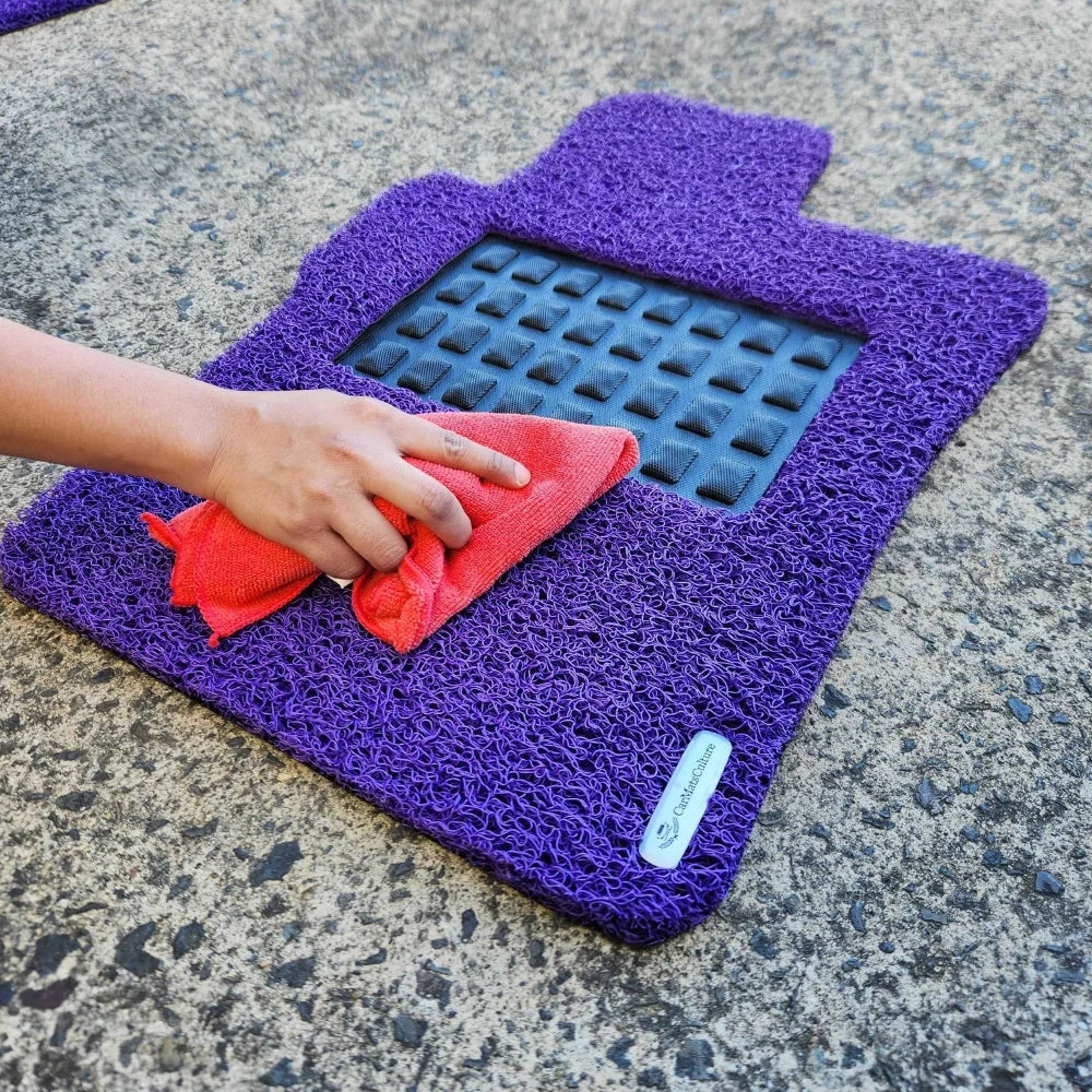 Wiping the surface of a Sangria Purple CarMatsCulture mat
