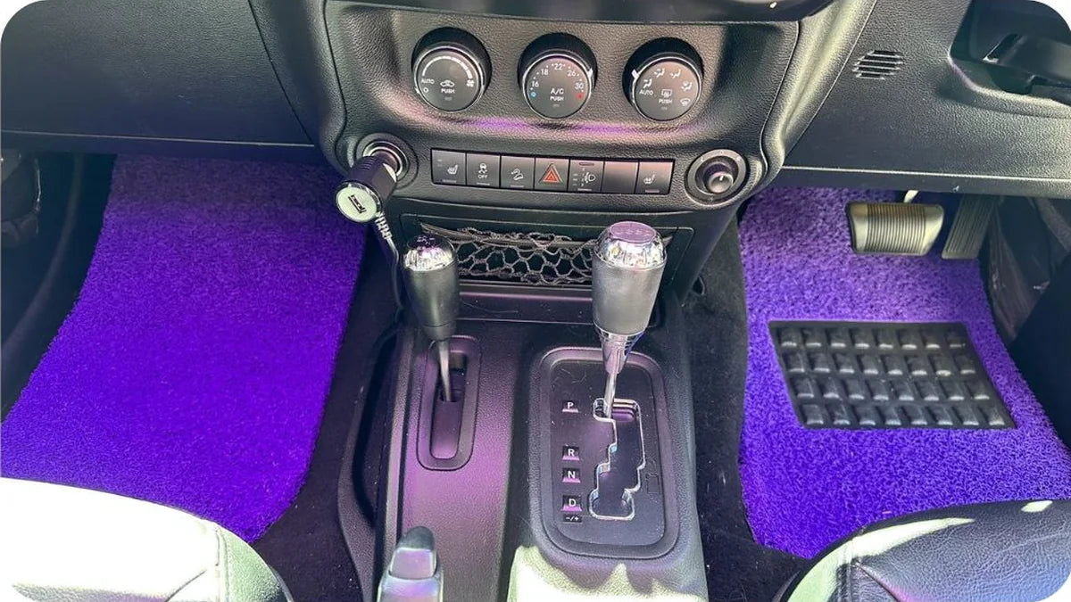 Purple CarMatsCulture mats installed in Samantha T.'s Jeep Wrangler