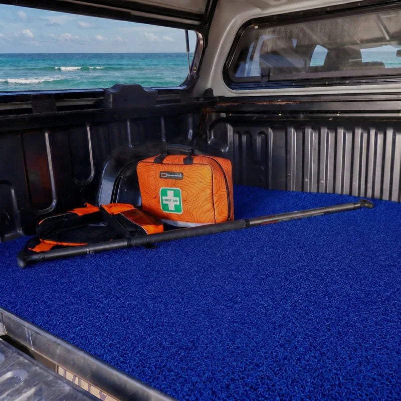 Stark Blue CarMatsCulture mat fitted in a customer vehicle cargo area